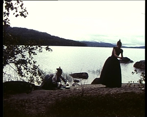 Washing dishes by the Lake Pielinen, the Mountain Koli on the background